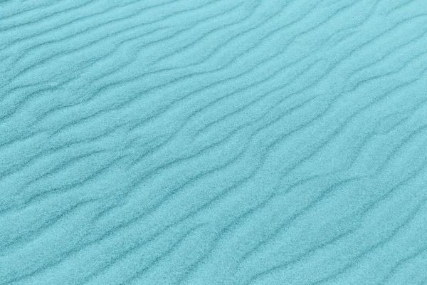 Textura de areia tonificada com cor azul — Fotografia de Stock