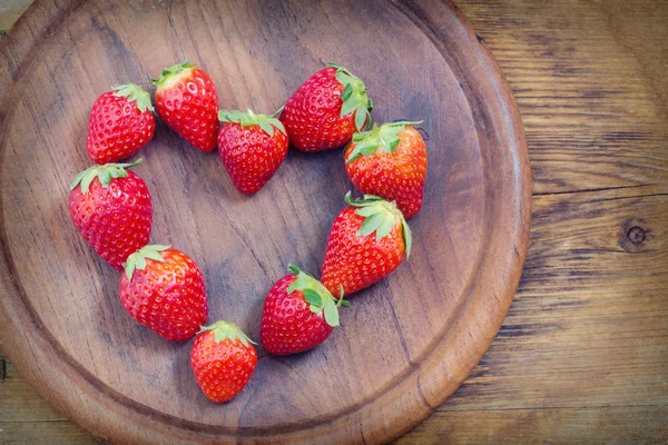 Strawberries with heart shape — Stock Photo, Image