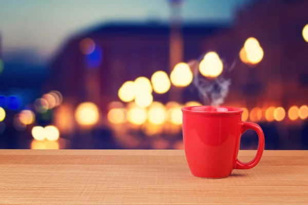 Red cup over city — Stock Photo, Image