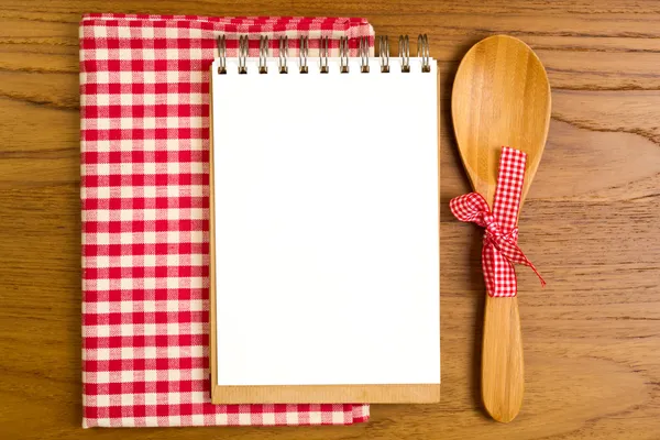 Blank note book with wooden spoon — Stock Photo, Image