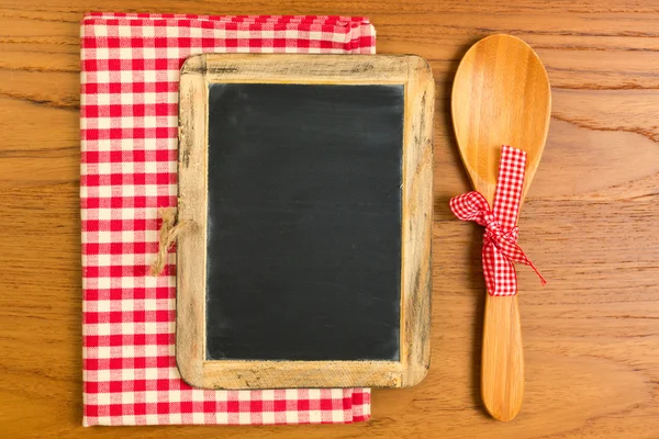 Chalkboard with wooden spoon — Stock Photo, Image