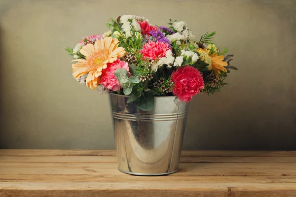 Flower bouquet in bucket — Stock Photo, Image