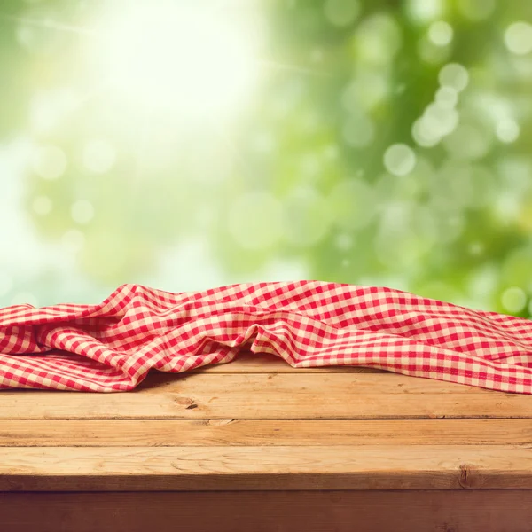 Empty wooden deck table with tablecloth — Stock Photo, Image