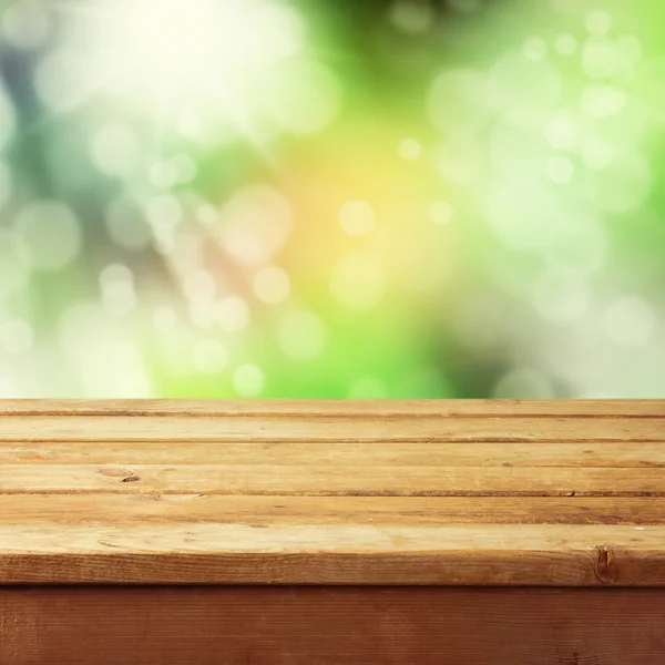 Mesa de madera con fondo bokeh — Foto de Stock