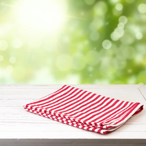 Background with wooden table and tablecloth — Stock Photo, Image