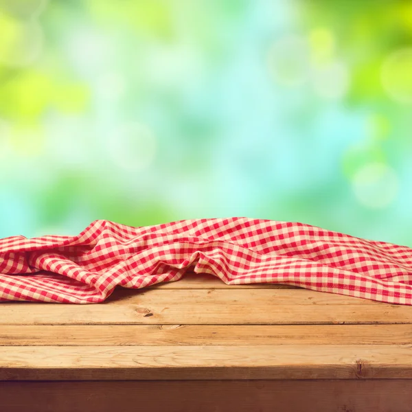 Empty wooden deck table with tablecloth Stock Image