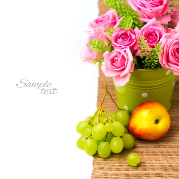 Rose flower bouquet and fruits — Stock Photo, Image