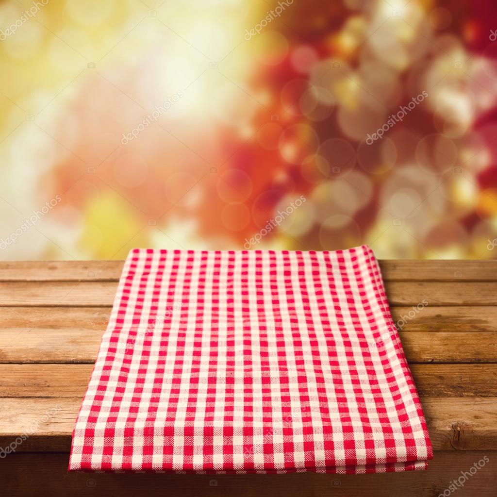 Wooden table with tablecloth Stock Photo by ©maglara 48120307