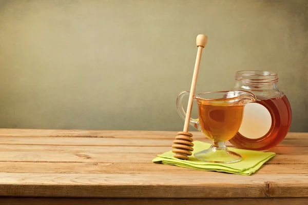 Honey on wooden table — Stock Photo, Image