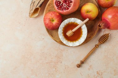Rosh Hashanah top view background with honey, apple and pomegranate. Flat lay