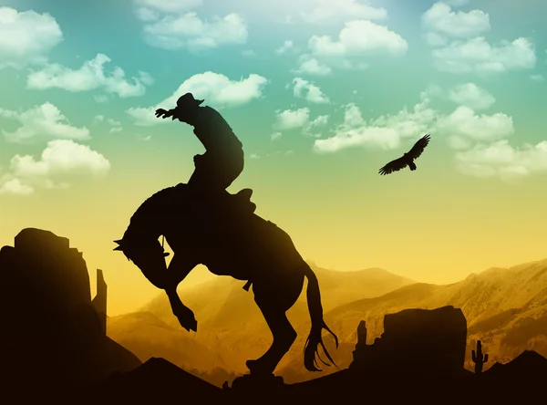 Silhouette cowboy con cavallo Foto Stock