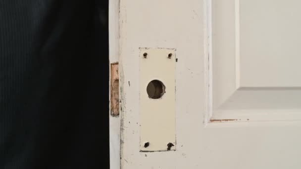 Man Hands Insert Door Lock Barrel Aged White Painted Internal — Stock Video