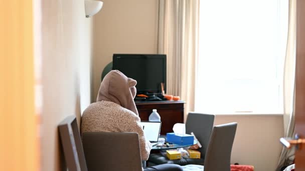 Slider Shot Obscures Female Hooded Dressing Gown Working Laptop Table — Stock Video