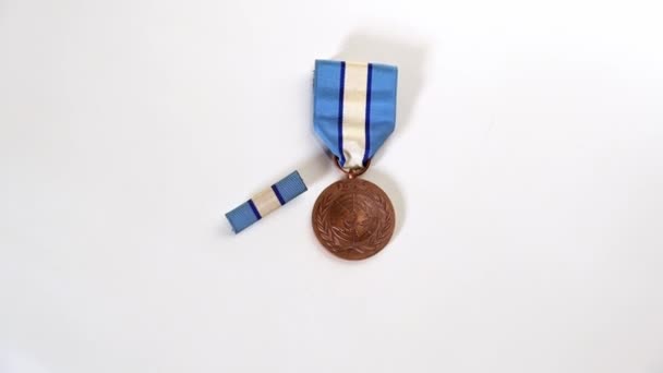 Overhead Moving View United Nations Peacekeeper Medal — Stock Video