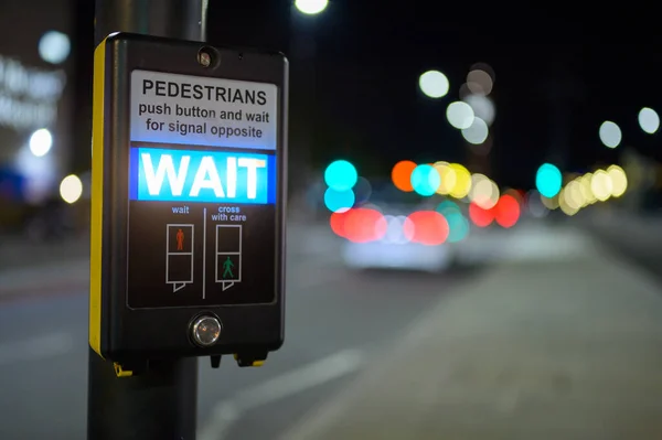 Pedestrian Crossing Button Illuminated Wait Sign Out Focus Traffic Background — ストック写真