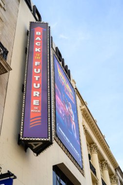 LONDON - May 18, 2022: Back to the Future, The Musical signs on the front of The Adelphi Theatre, London