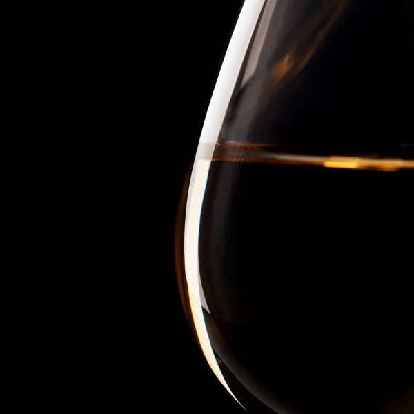 Detail of the brandy glass on the black background — Stock Photo, Image