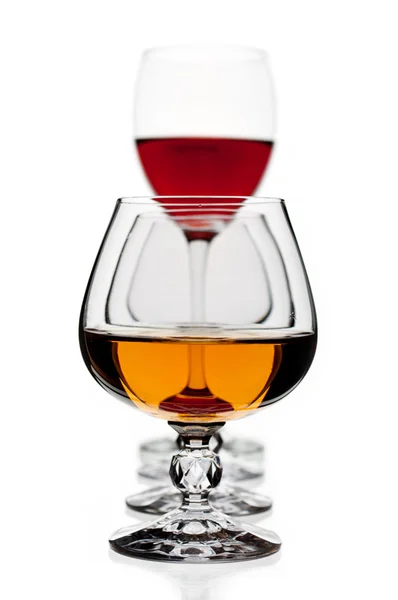 Wine and brandy glasses on the white background — Stock Photo, Image