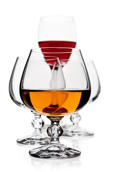 Wine and brandy glasses on the white background — Stock Photo, Image