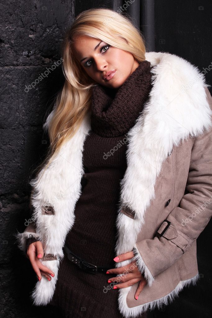 Beautiful blond woman in a fur — Stock Photo © EugenePartyzan #22915982