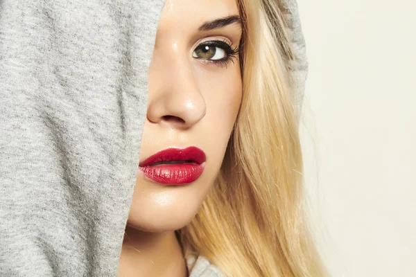 Beautiful blond woman in hood. red lips. text here — Stock Photo, Image