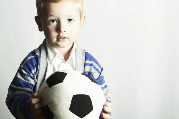 Little boy with soccer ball.stylish kid. fashion children — Stok fotoğraf