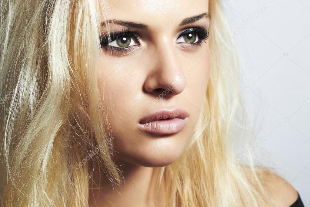 beautiful blond girl with green eyes.woman.make-up