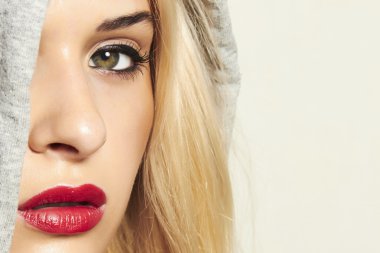 Beautiful blond woman in hood. red lips clipart