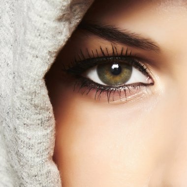 Beautiful green eye of woman. girl in hood clipart