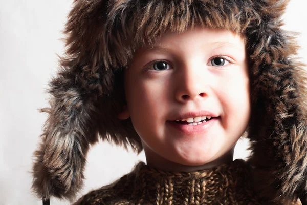 Funny smiling child in fur hat.fashion.winter style.little boy — Stock Photo, Image