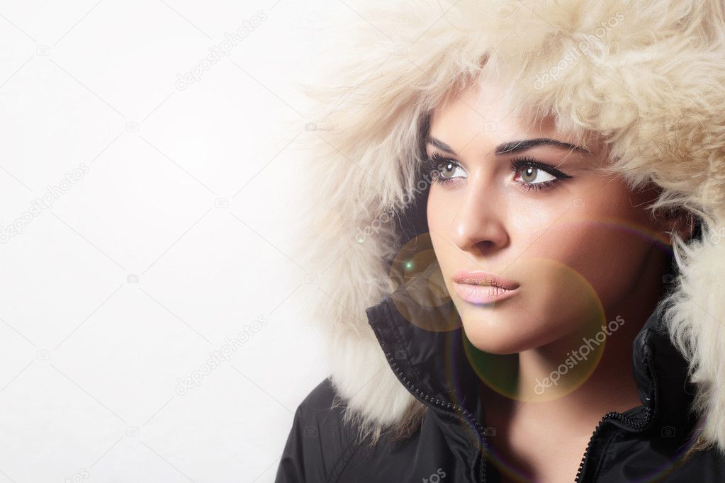 Beautiful woman with fur. hood. winter style.your text here