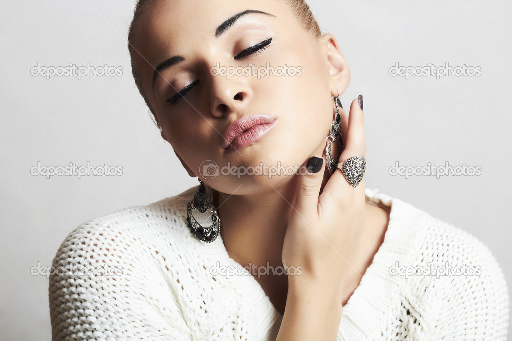 Beautiful woman in white woolen  and .liquid  sand  style fashion Stock Photo by ©EugenePartyzan  34654989