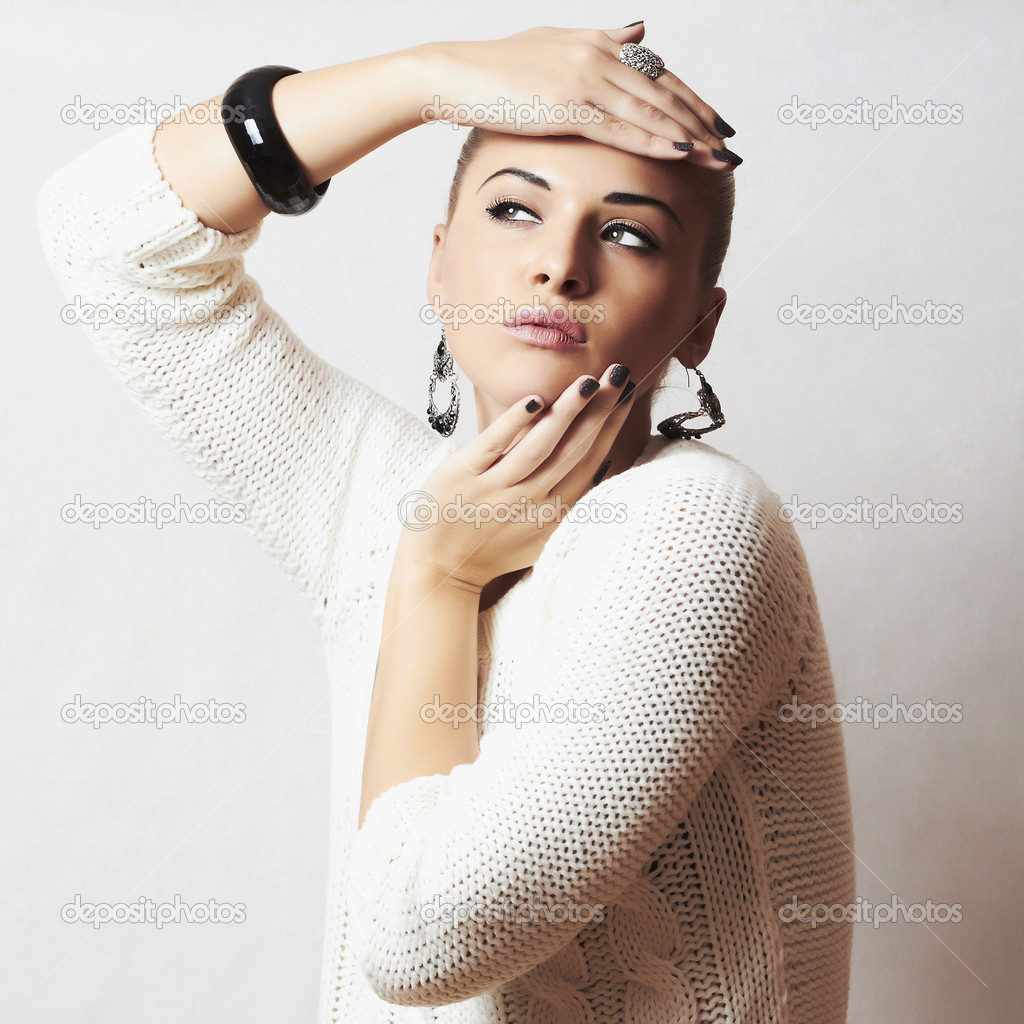 Beautiful woman in white woolen  and .liquid  sand  style fashion Stock Photo by ©EugenePartyzan  34792769