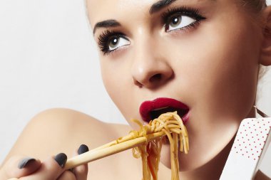 Beautiful woman eating chinese food. wok. noodles clipart