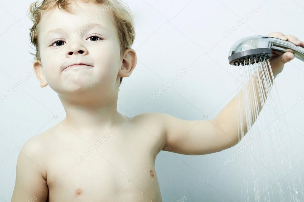 Smiling little boy is bathed in the shower.Bath.child