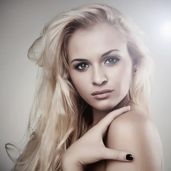 Beautiful blond woman. light background. beauty girl Royalty Free Stock Images