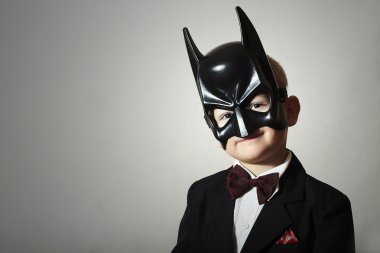 Boy in Batman Mask. Funny Child in Black Suit clipart