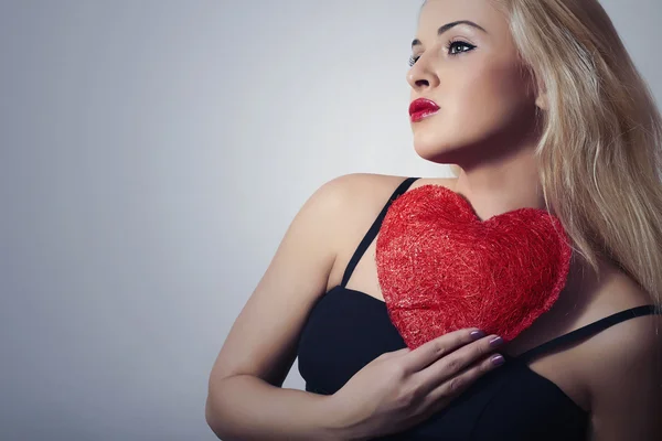Beautiful Blond Woman with Red Heart. Beauty Girl. Show Love Symbol. Valentine's Day. Black Dress — Stock Photo, Image