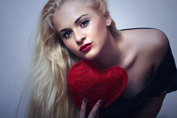 Woman with red heart — Stock Photo, Image