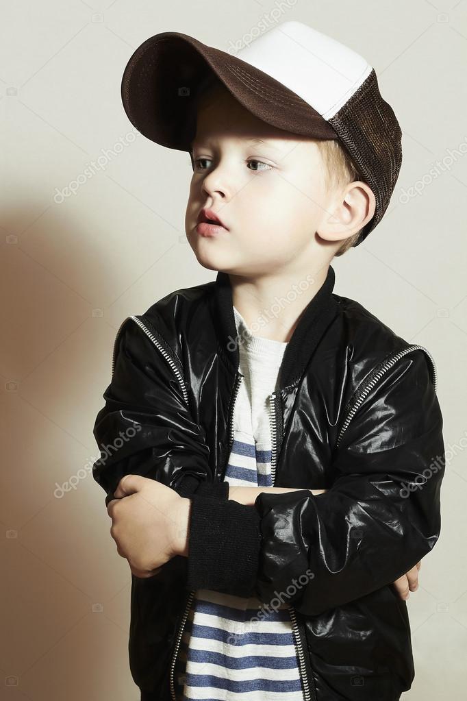 Hip Hop Style Fashion Children Handsome Blond Kid With Big Blue Eyes Pose Boy In Tracker Hat Young Rapper Funny Child In Cap Hip Hop Style Fashion Children Handsome Blond Kid With Big Blue Eyes Pose Boy In Tracker Hat Young Rapper Funny Child In Cap