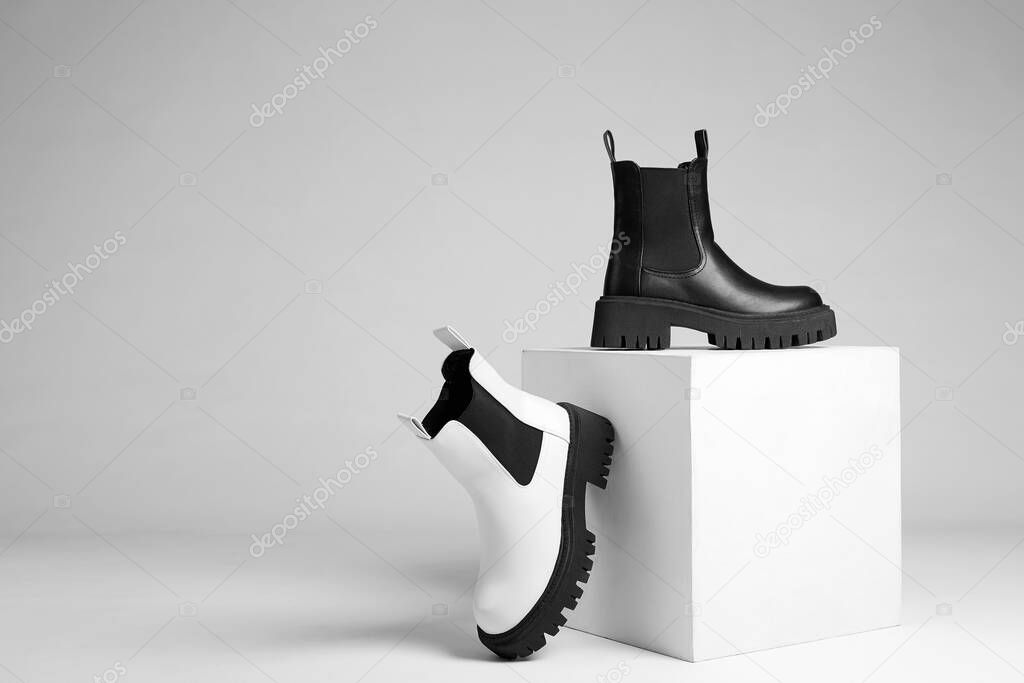 black and white boots. fashion shoes still life. stylish photo in the studio