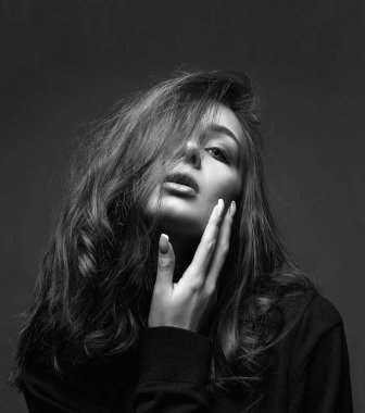 black and white portrait of Beautiful young woman. sensual beautiful girl with make-up and curly Hair