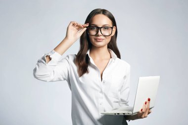 beautiful smiling woman in glasses. Student girl with laptop. Business lady