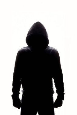Man in Hood. Boy in a hooded sweatshirt. Male silhouette