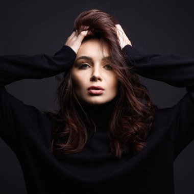 Beautiful young woman portrait. sensual girl with make-up and curly Hair