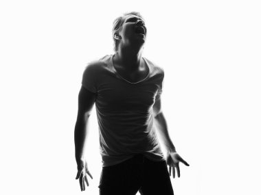 Silhouette of sad boy. black and white portrait of screaming young man