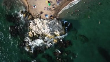 Aerial view of Cala Roca Grossa beach, in Calella province, Catalonia, Spain.Platja de la Mar Menuda on Costa Brava. High quality 4k footage