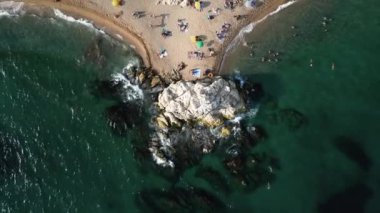 Aerial view of Cala Roca Grossa beach, in Calella province, Catalonia, Spain.Platja de la Mar Menuda on Costa Brava. High quality 4k footage