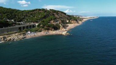 Aerial view of Cala Roca Grossa beach, in Calella province, Catalonia, Spain.Platja de la Mar Menuda on Costa Brava. High quality 4k footage