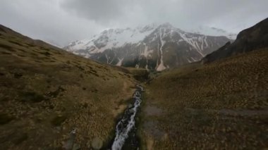 backwards FPV drone shot up the big waterfall. High quality 4k footage
